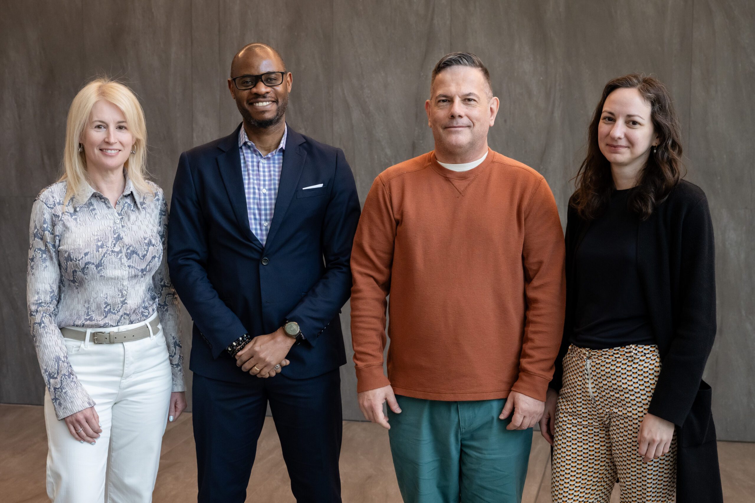 Members of the Ontario Regional Team posing at a conference. From left to right; Ann Burchell (former co-lead), Lawrence Mbuagbaw, Patrick Cupido, and Mona Loufty