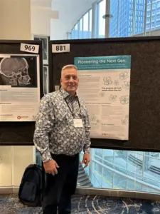 Darren Lauscher presenting a poster on community voices in research at the Patient Voices 2025 conference. 
